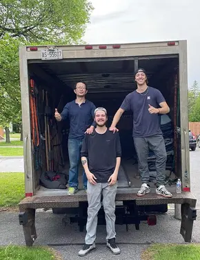 foosun-moving-ottawa-movers-standing-in-the-back-of-moving-truck