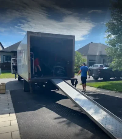 a-professional-mover-of-foosun-moving-walking-beside-the-moving-truck